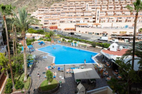 Отель Tropic Apartments en Castle harbour  Арона